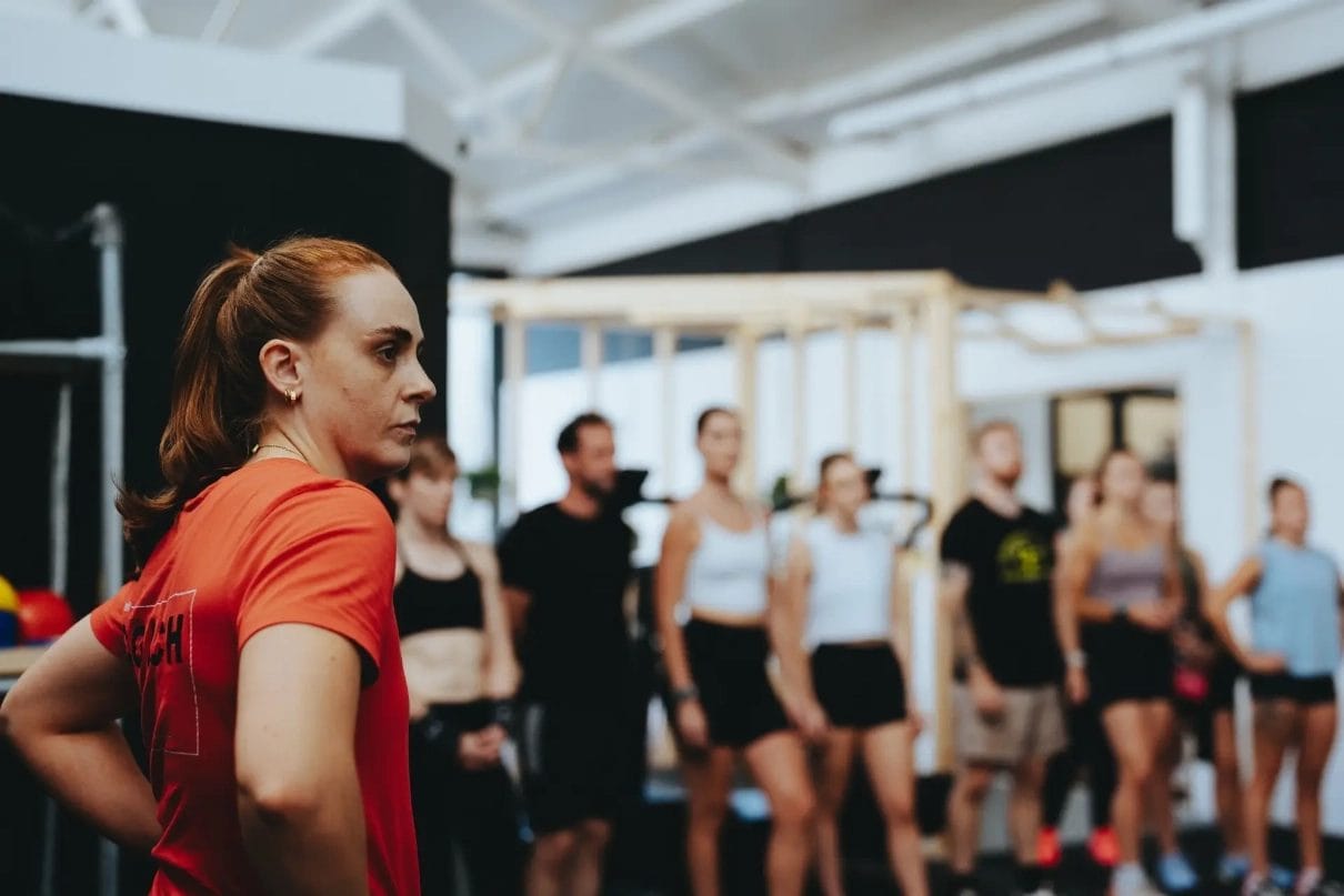 woman taking a group training class