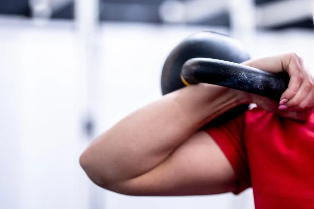 woman training with a kettlebell