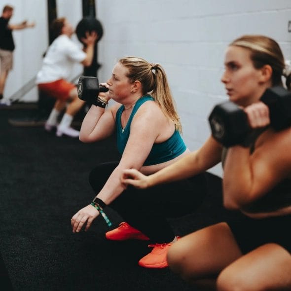 women training with kettlebells