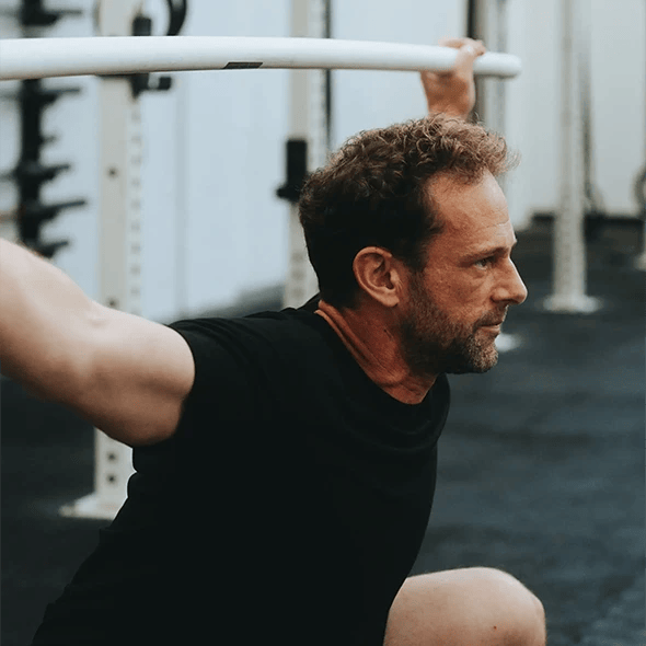 man lifting weights at the gym
